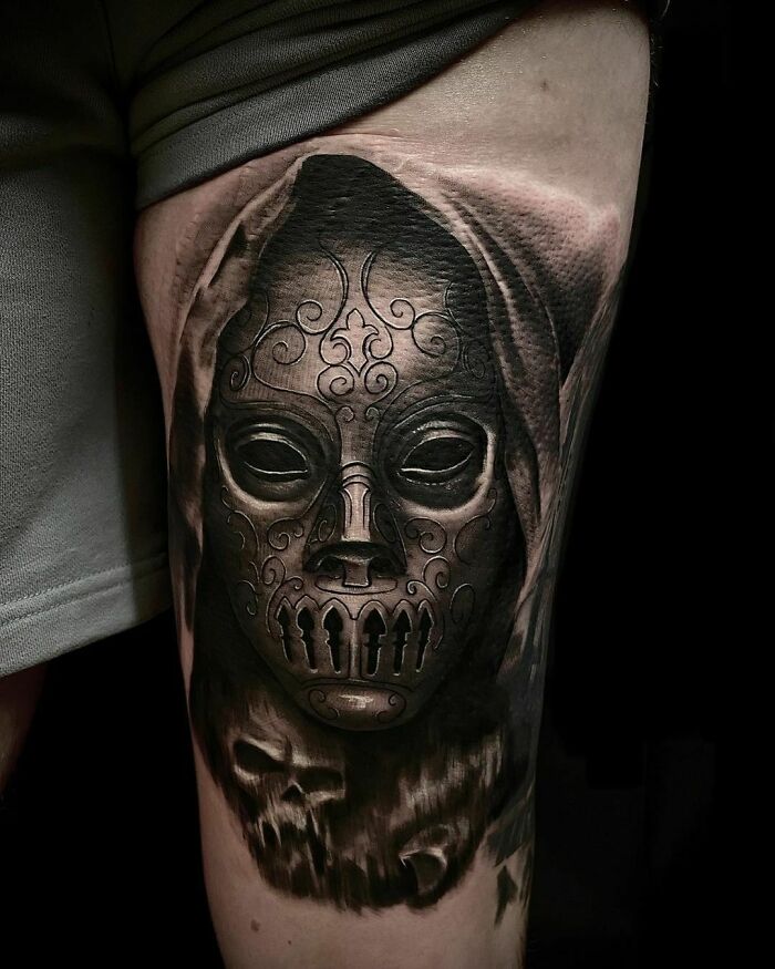 Dark Harry Potter tattoo of a Death Eater mask on thigh.
