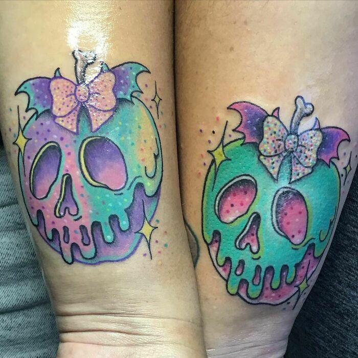 Matching colorful poison apple tattoos