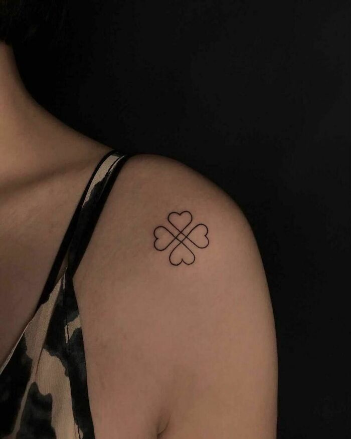 Single line clover shoulder tattoo
