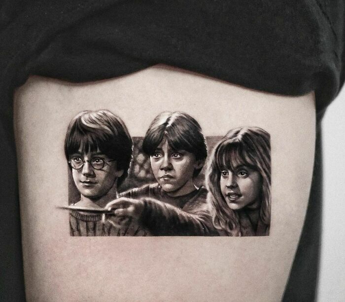 Tattoo of three Harry Potter characters on the arm.