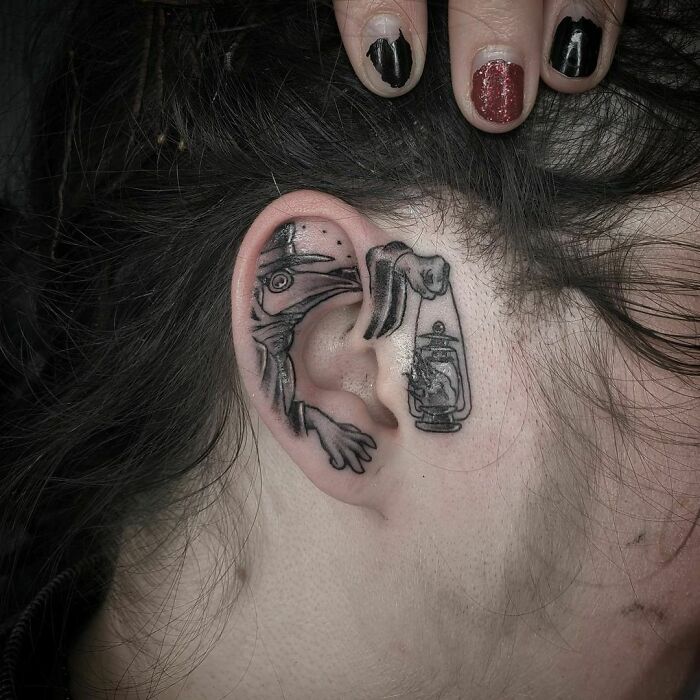 ear tattoo of a plague doctor