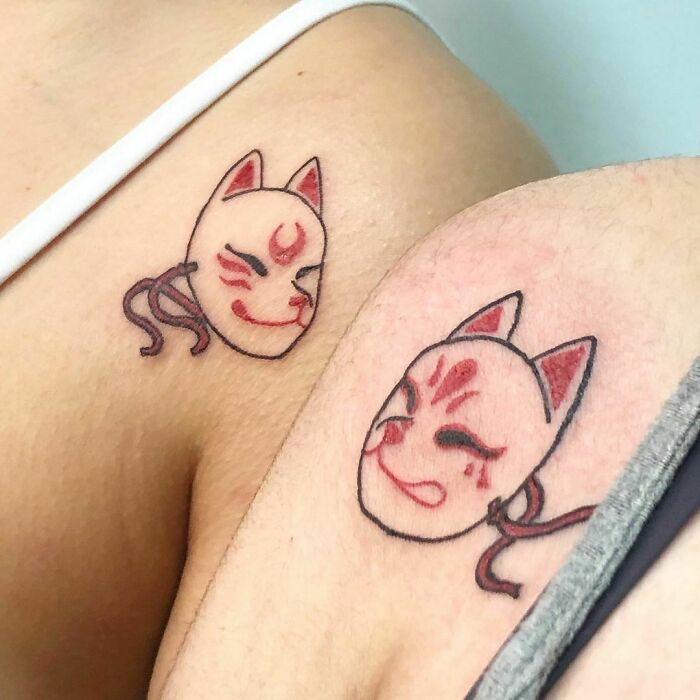 Matching Kitsune mask tattoos
