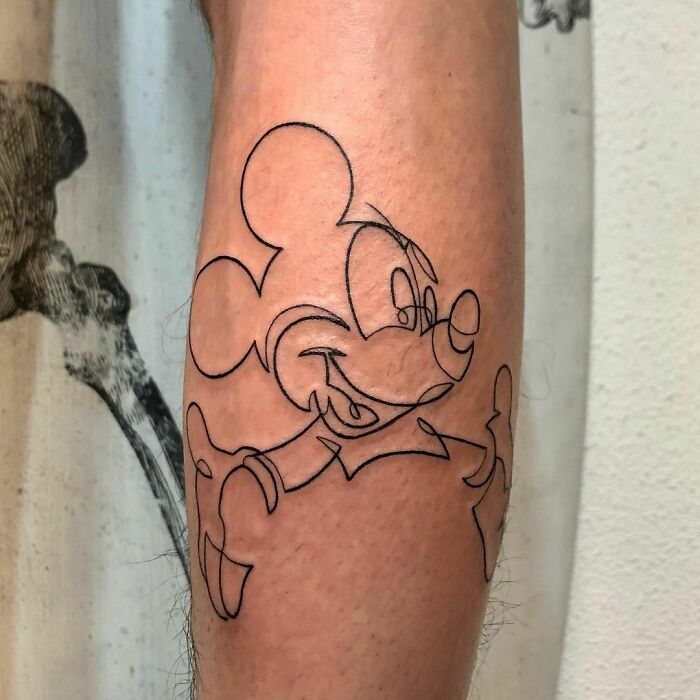 Single line Mickey mouse leg tattoo