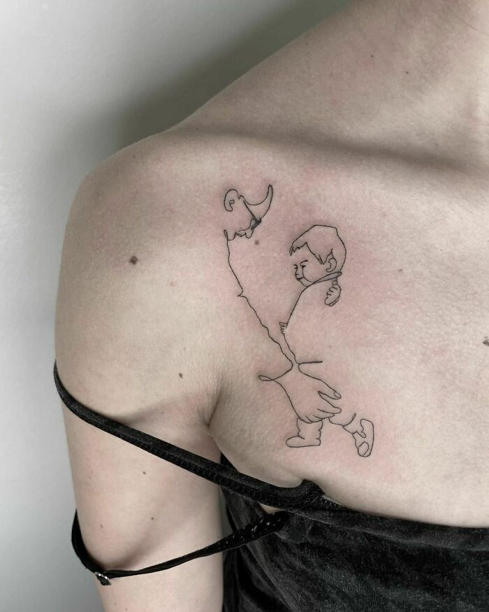 Single line father and son shoulder tattoo