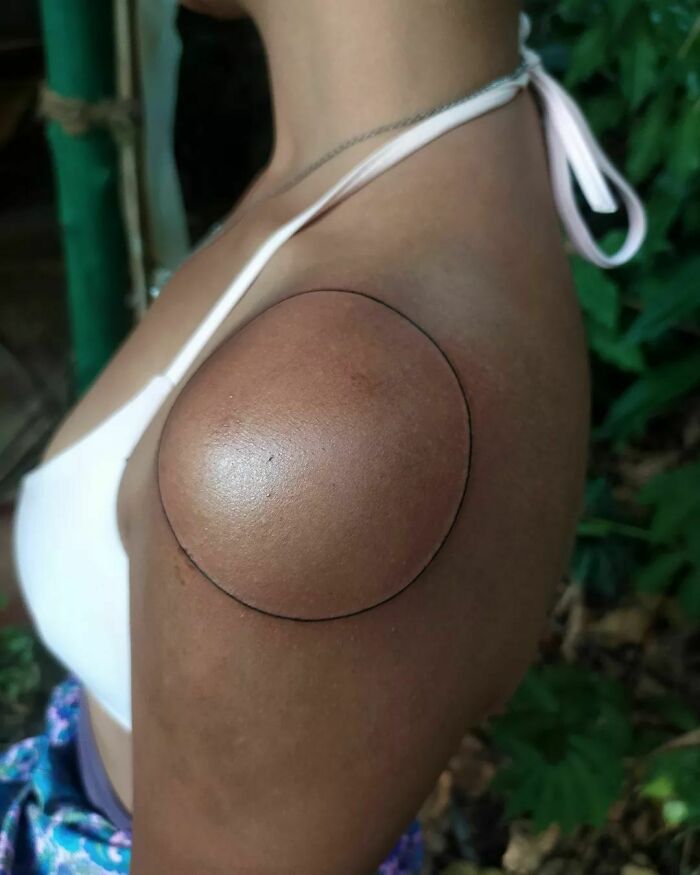 Circle shoulder tattoo