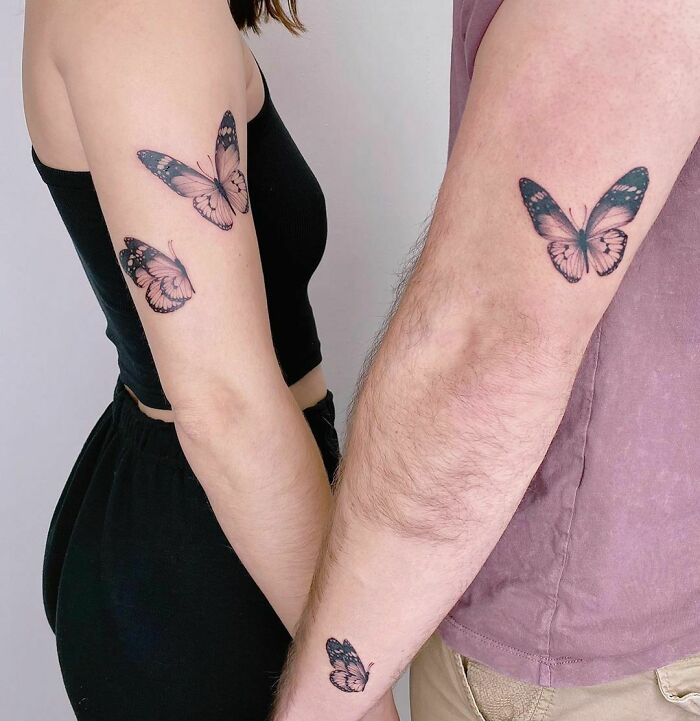 Flying butterflies tricep tattoos