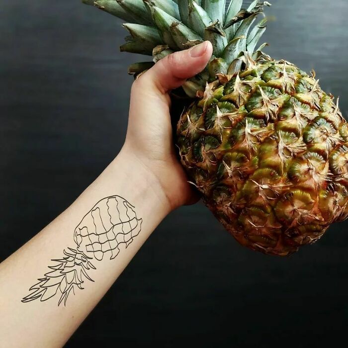 Single line pineapple wrist tattoo