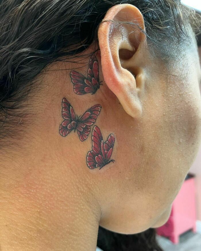 ear tattoo of three butterflies 