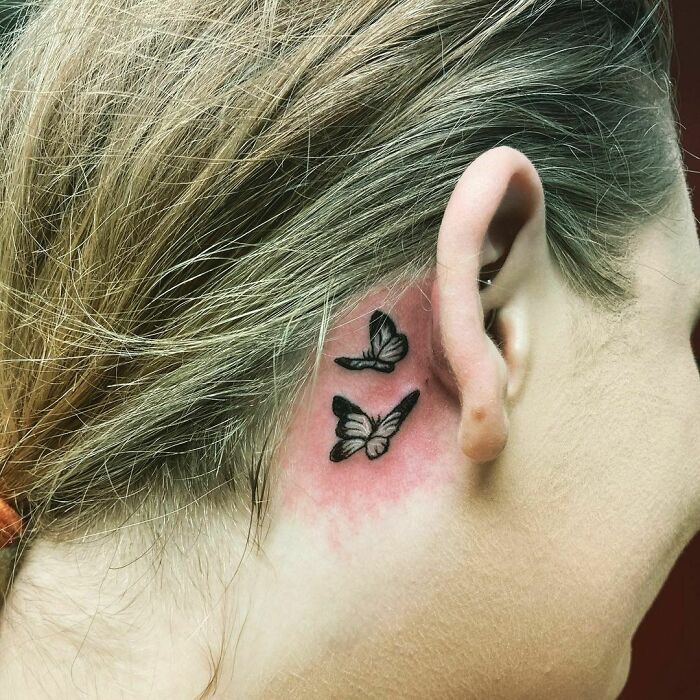 ear tattoo of two butterflies