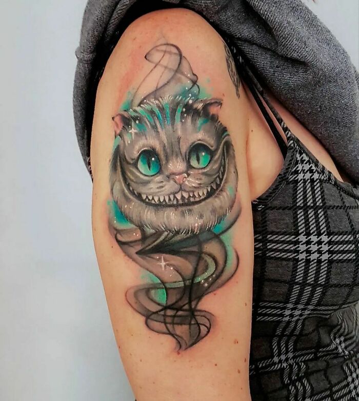 Cheshire Cat arm tattoo