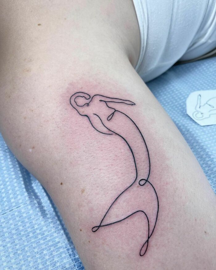 Single line mermaid arm tattoo