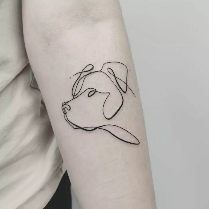 Line dog arm tattoo