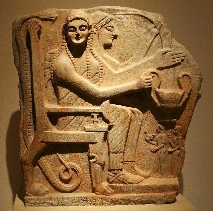 Laconian Marble Grave Relief Depicting Two Enthroned Heroes Receiving Offerings From (Far Smaller) Worshipers. Artist Unknown; Ca. 550-530 Bce. Found At Chrysapha, Near Sparta; Now In The Altes Museum, Berlin