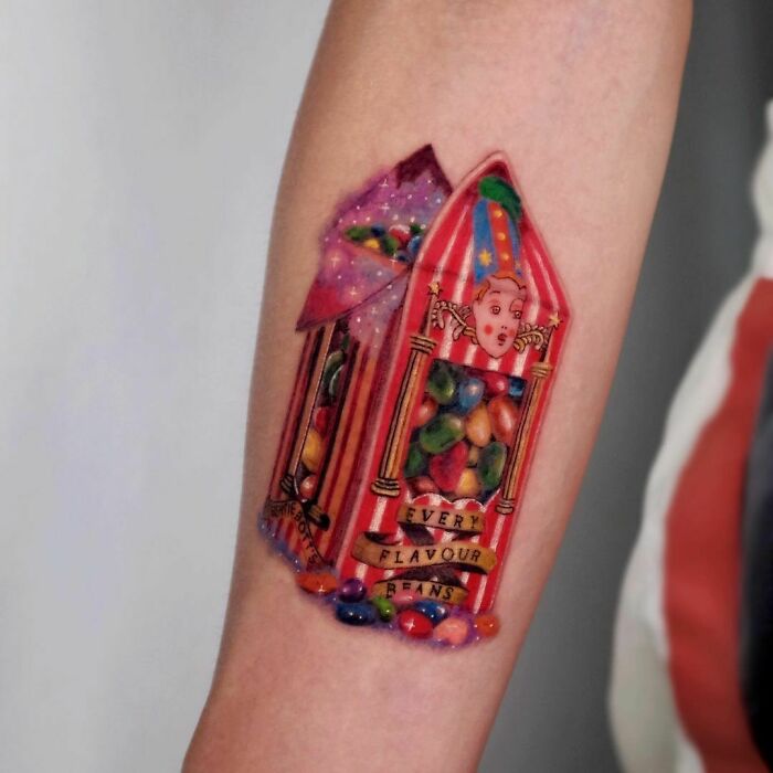 Harry Potter tattoo depicting Bertie Bott’s Every Flavour Beans on forearm.