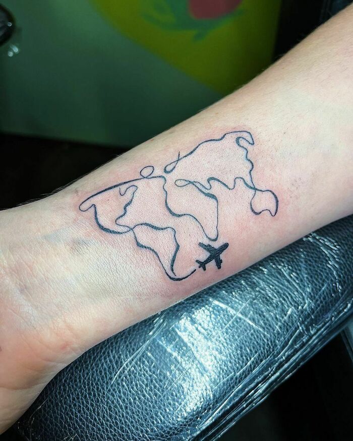 Live country travel arm tattoo