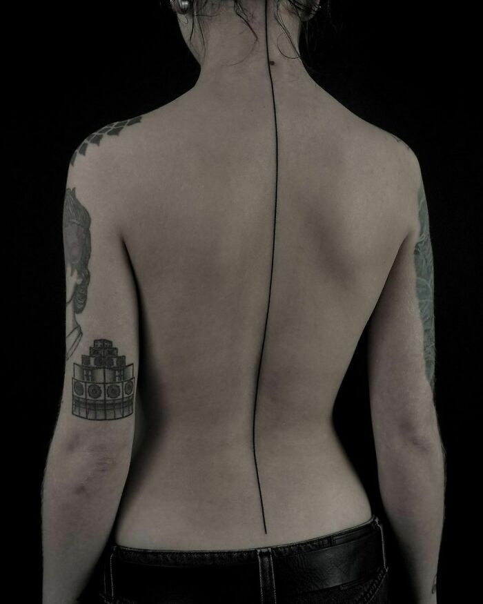 Single line back spine tattoo