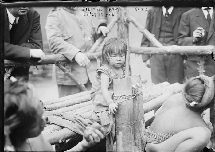 A Filipino Baby And Her Family Inside A Human Zoo In New York, USA. 1906