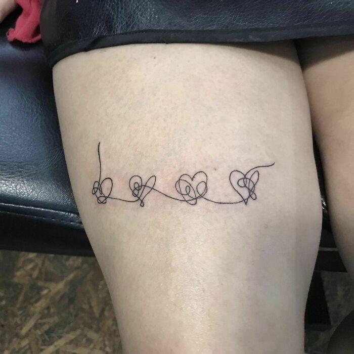 Single line hearts leg tattoo