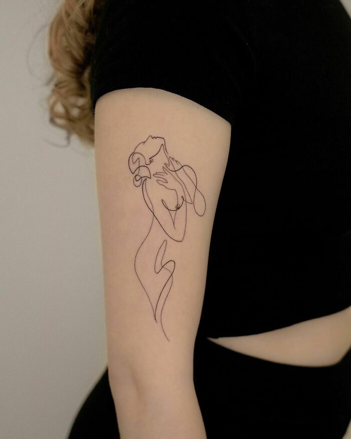 Single line naked woman tattoo