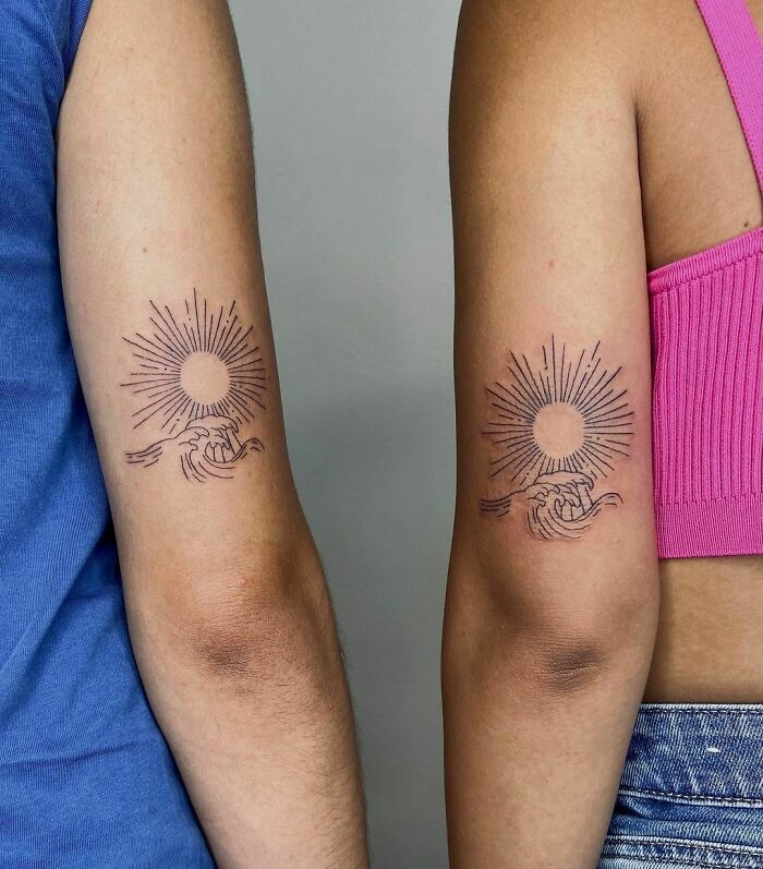 Sun and ocean matching elbow tattoos