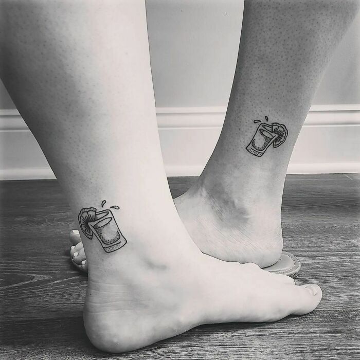 Matching tequilla shot leg tattoos