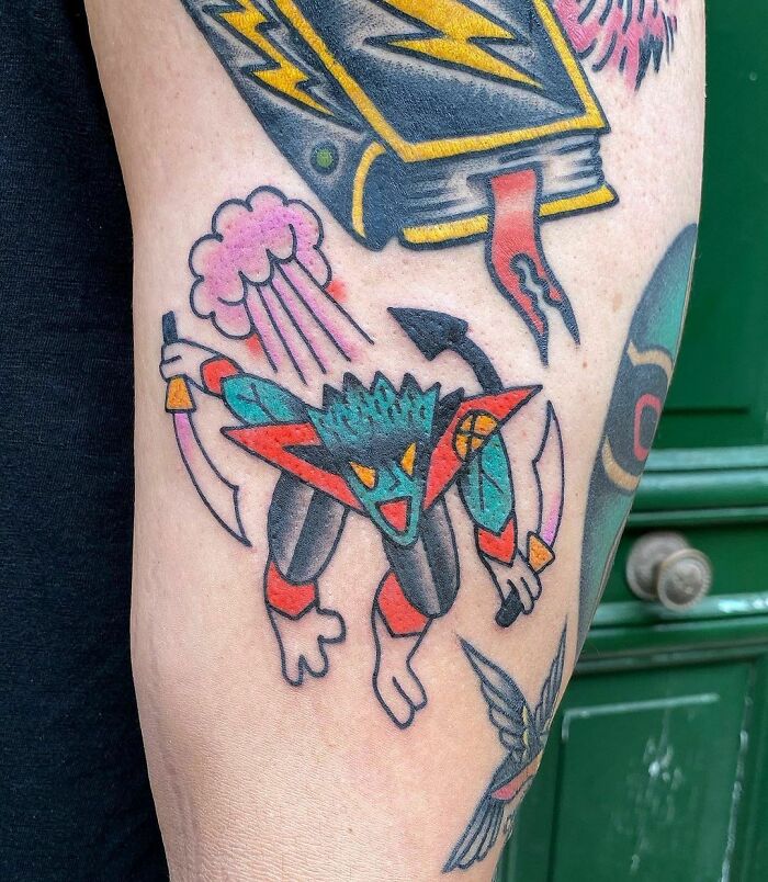 Colorful superhero Nightcrawler tattoo featuring dynamic shapes and vibrant colors on an arm.