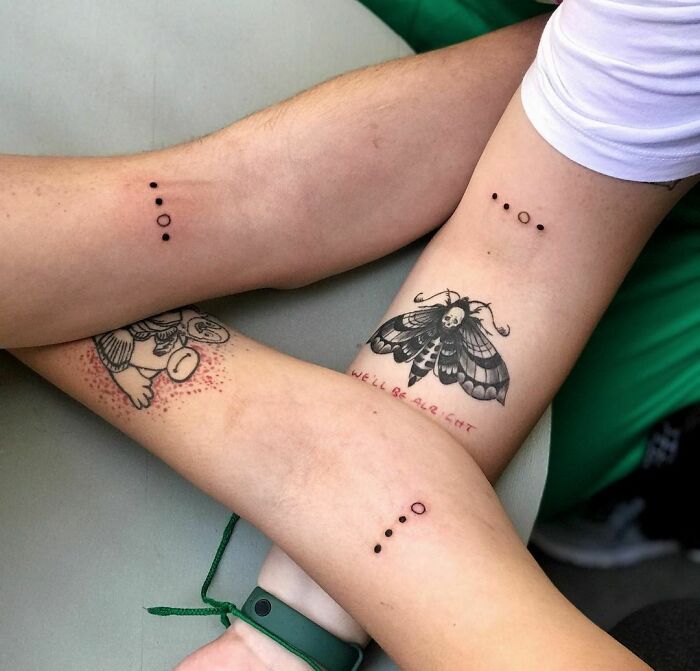 Dots matching elbow tattoos