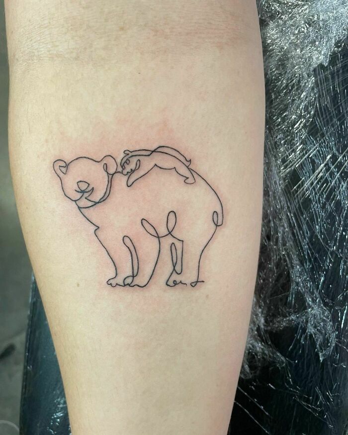 Line baby bear with bear mama arm tattoo