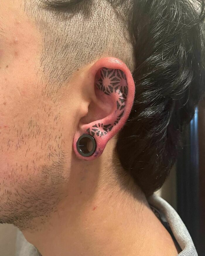 ear tattoo of a ornamental design