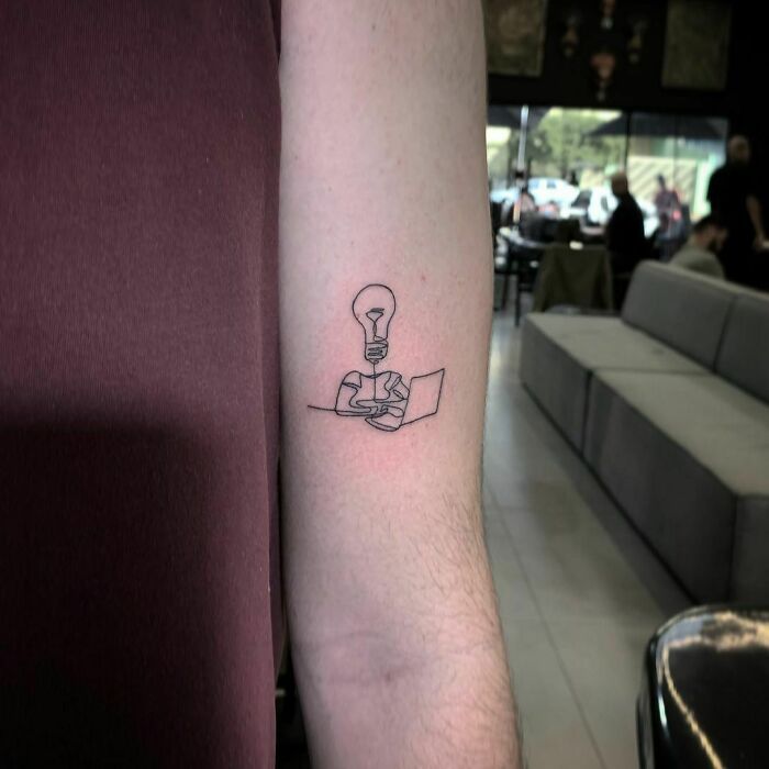 Single line light bulb and computer tattoo