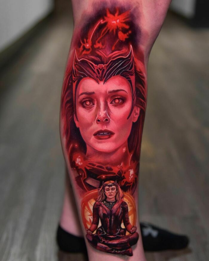 Marvel tattoo of Scarlet Witch Wanda Calf on a leg, featuring detailed red and black shades highlighting her intense gaze and costume.