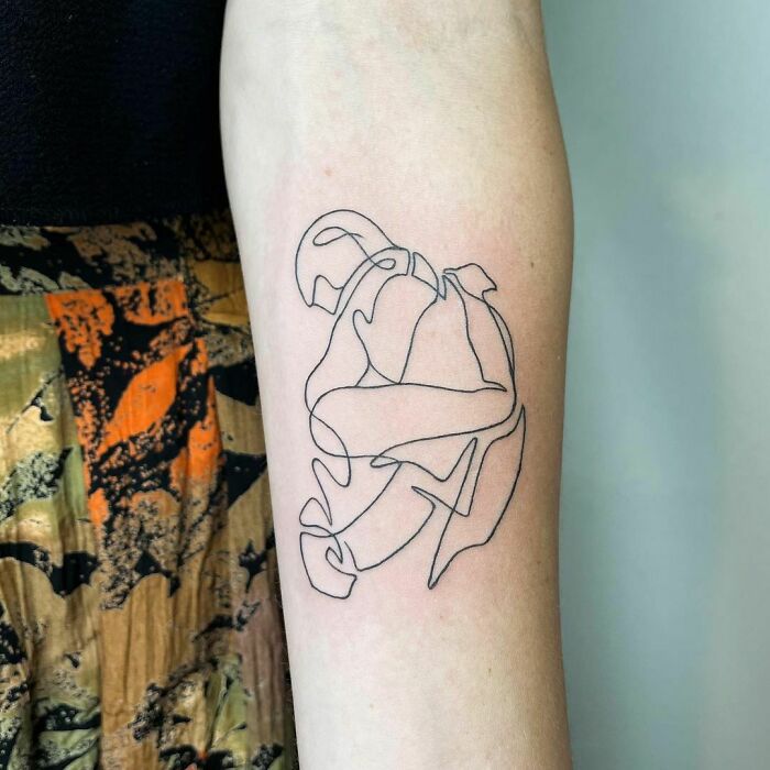 Single line woman and a man hugging tattoo