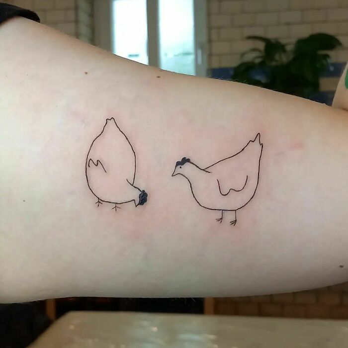 minimalistic tattoo of two chickens