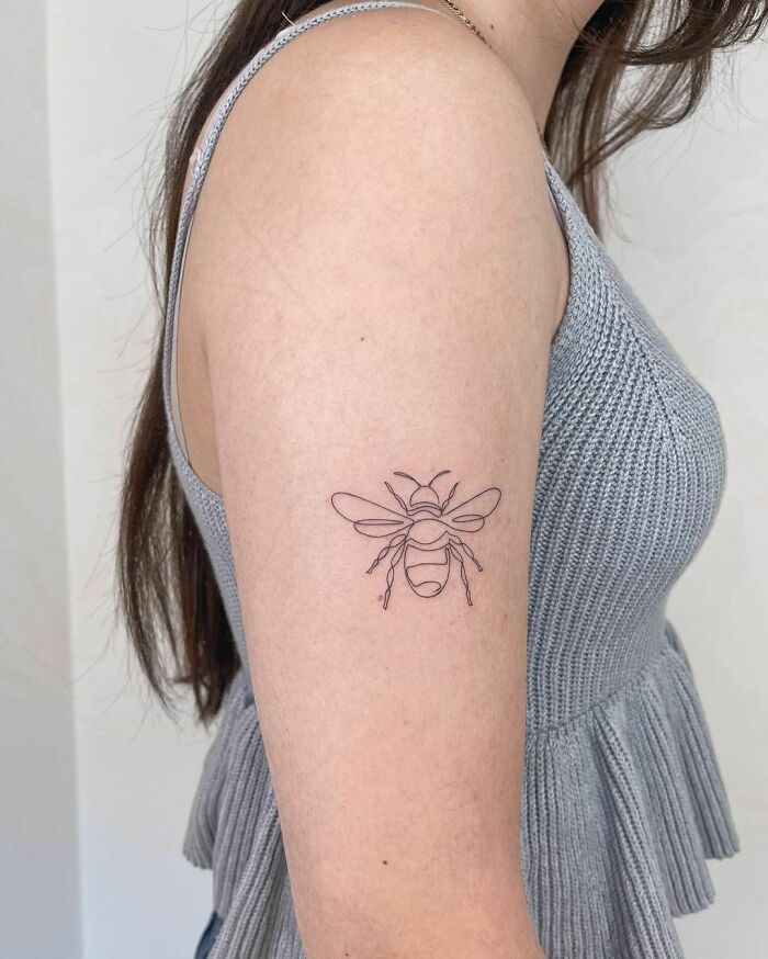 Line bee arm tattoo