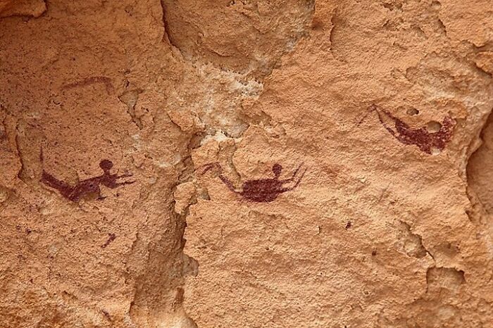 Neolithic Pictographs Depicting People With Their Limbs Bent As If They Were Swimming. Date: 10.000 Years Ago. Cave Of The Swimmers, Gilf Kebir Plateau, Egypt