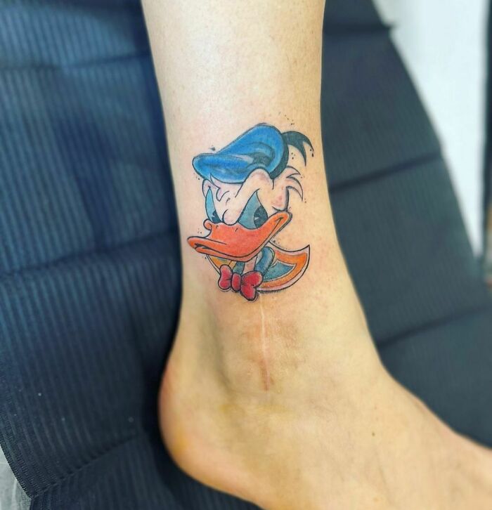 Donald Duck leg tattoo