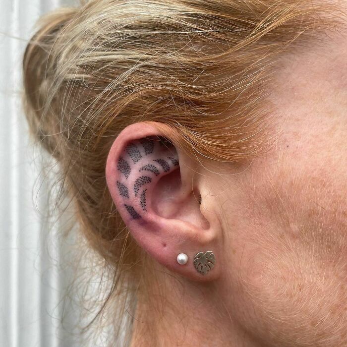 ear tattoo of an abstract dot design