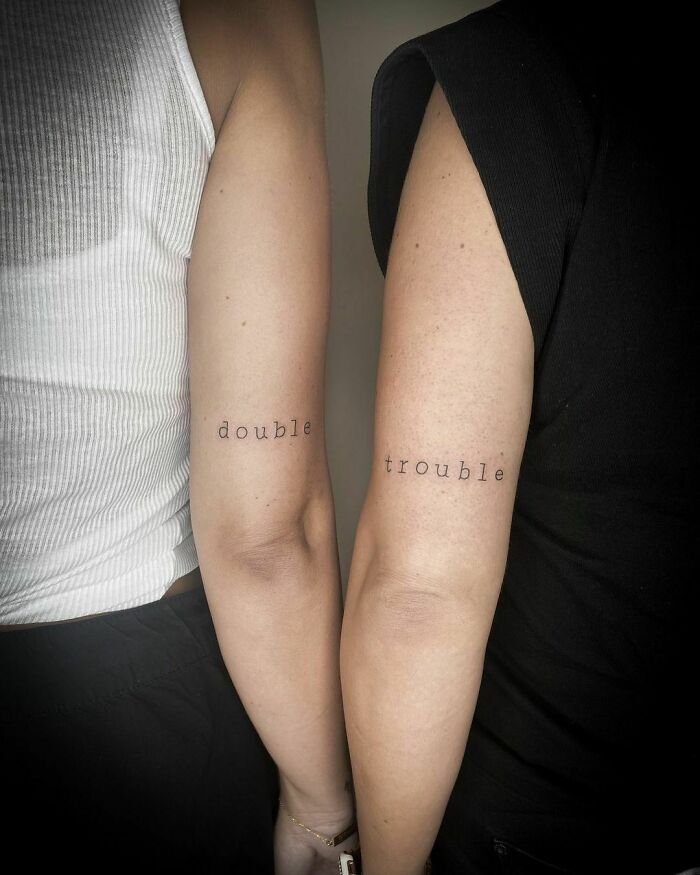Best Friend script 'double' and 'trouble' arm tattoos