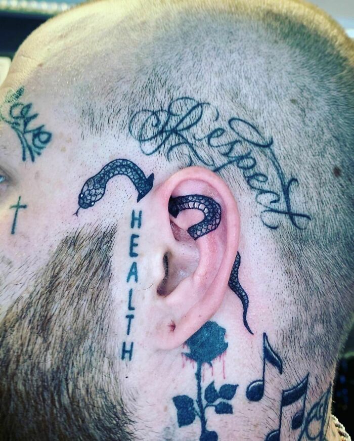 ear tattoo of a snake