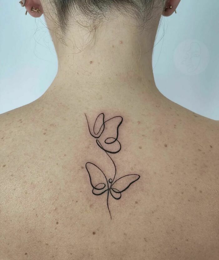 Single line butterflies back spine tattoo