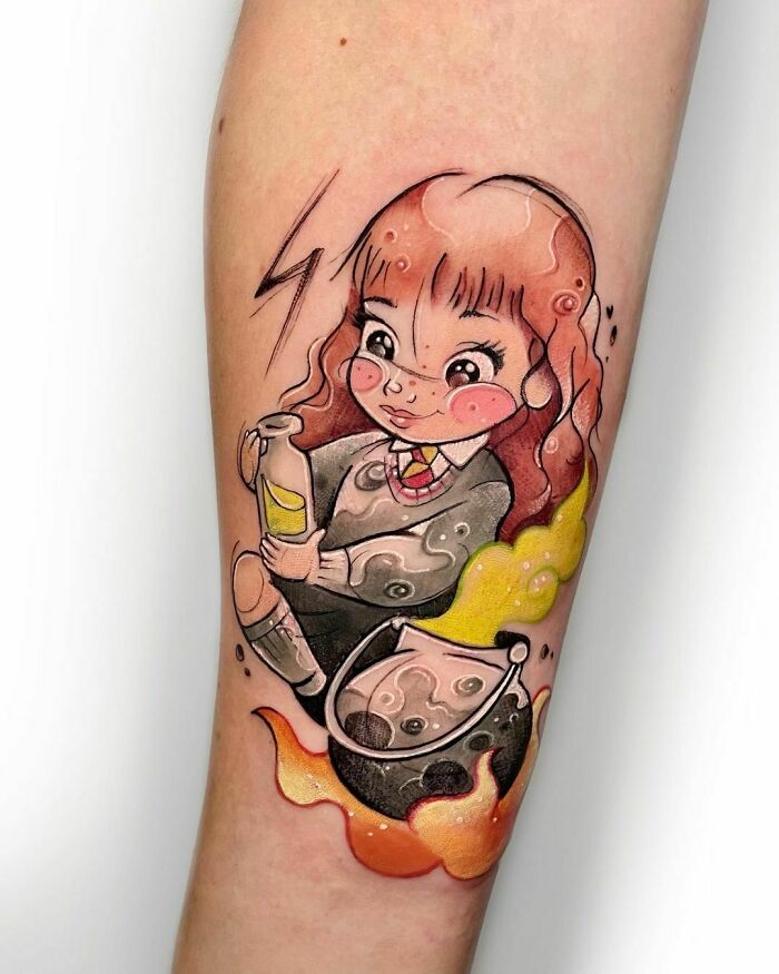 Cartoon Hermione Granger tattoo with potion and cauldron, featuring Harry Potter themed elements.