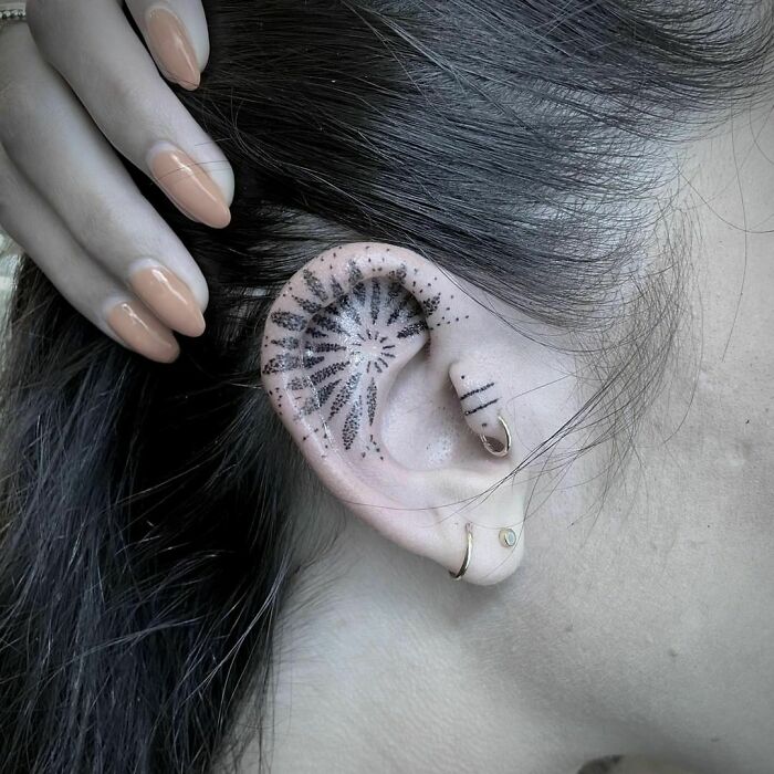 ear tattoo of a dot pattern