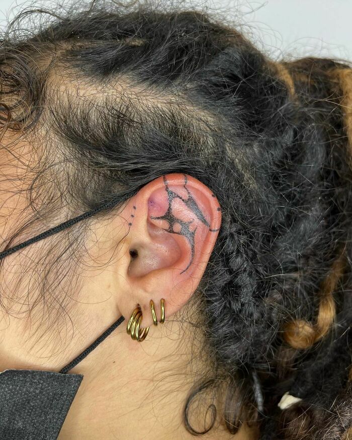 ear tattoo of a freehand pattern