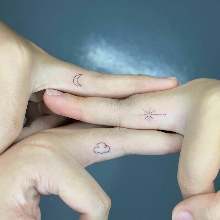 Best friend moon, star and cloud finger tattoos