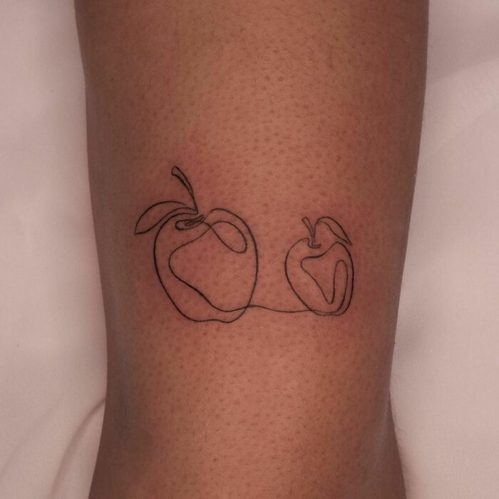 Single line two apples tattoo