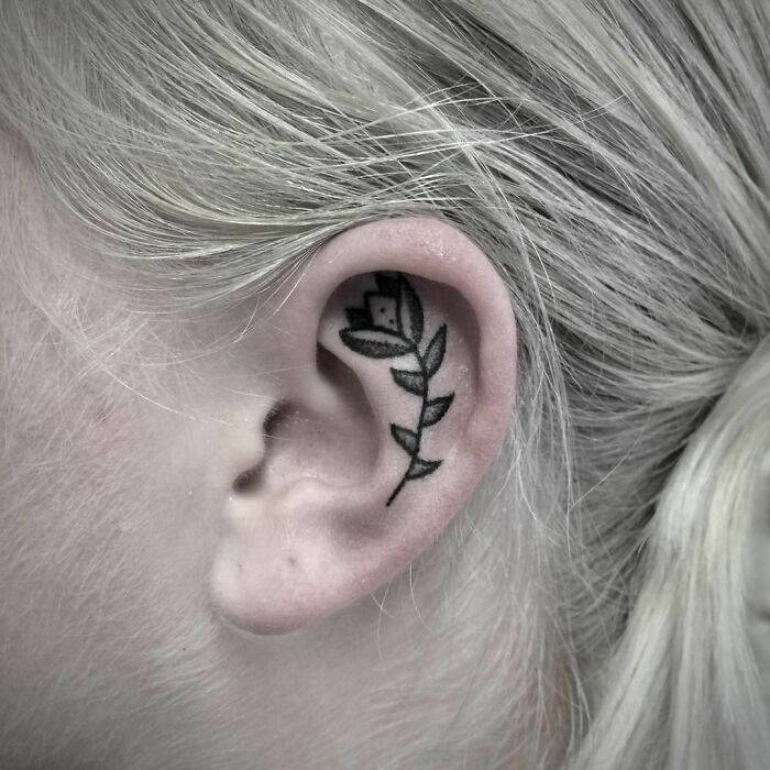 ear tattoo of a tulip flower