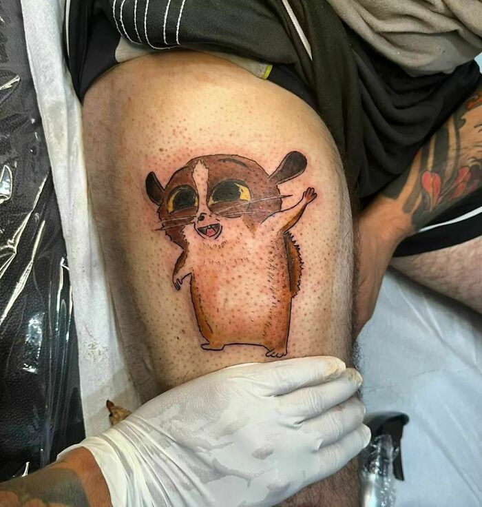Mort from Madagascar thigh tattoo