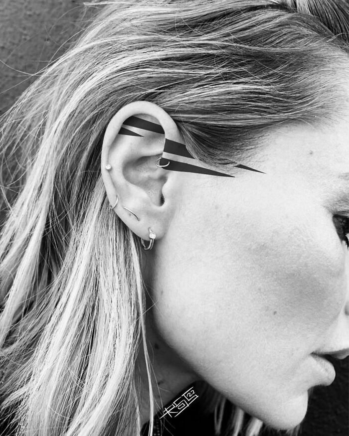 ear tattoo of solid lines
