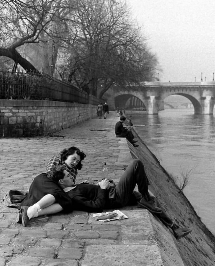 A Couple Relaxing On The Banks Of The Seine River In Paris, France - During The Spring Of 1949. Photo By Nat Farbman