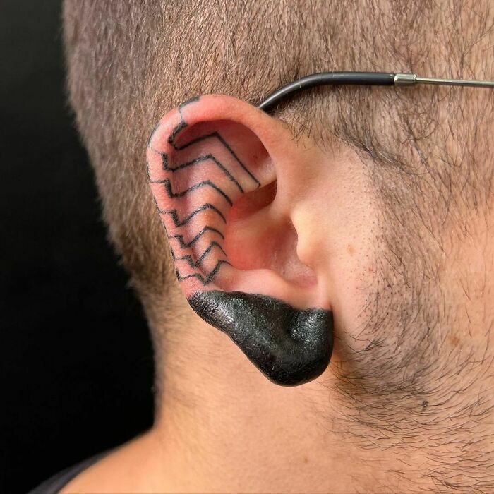 ear tattoo of a simple line design